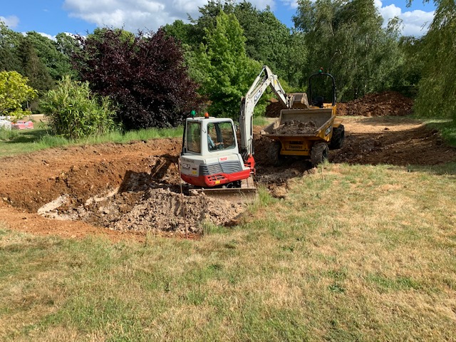 Preparing the ground for a natural pond