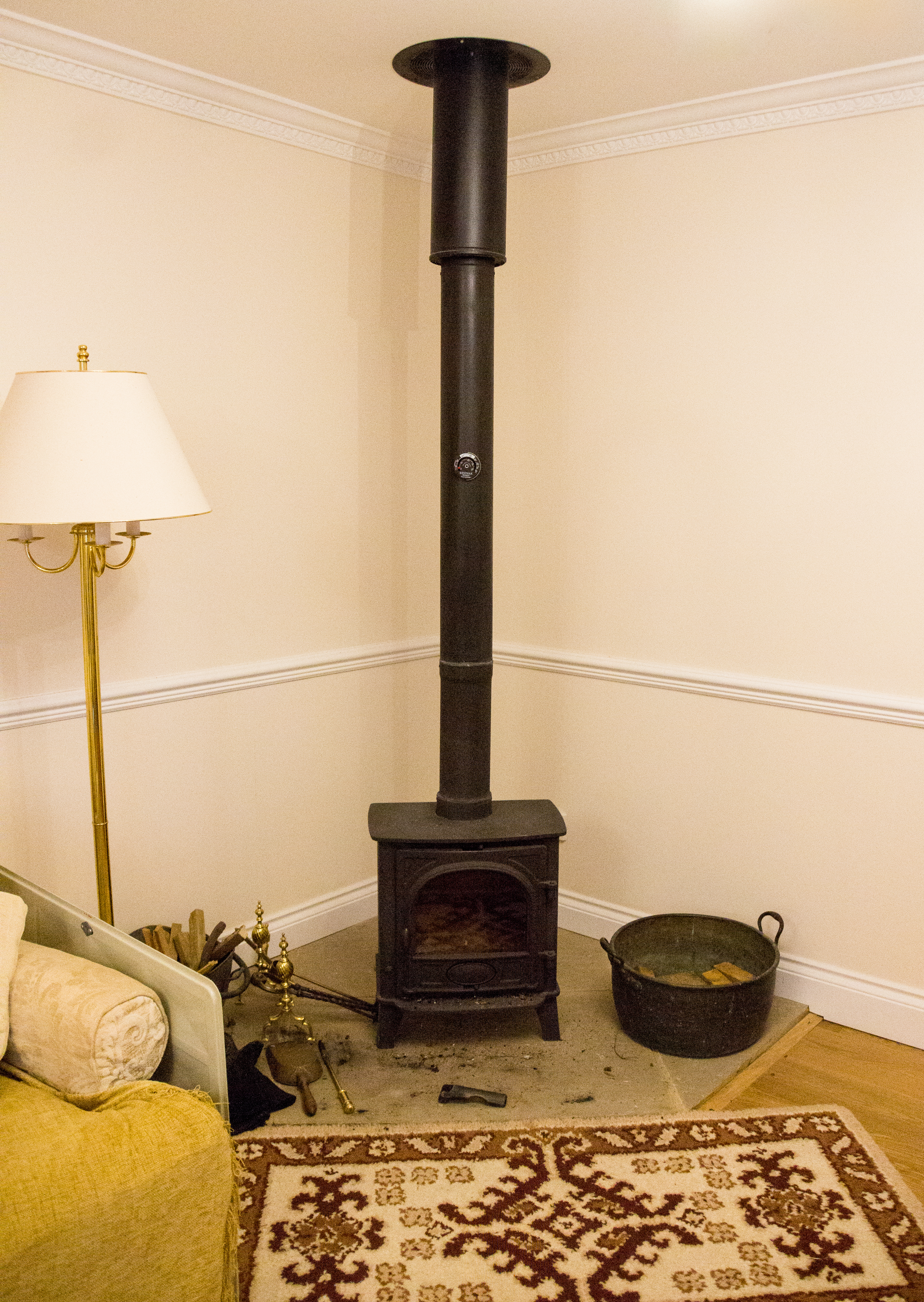 Wood burner installed in the corner of the room